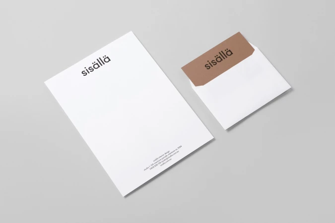 Branding mockup featuring a white letterhead and envelope with brown flap displaying the sisällä logo on a grey background