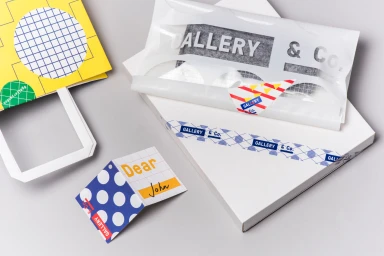 Branded packaging, paper bag, and tag with geometric patterns and typography for Gallery & Co.