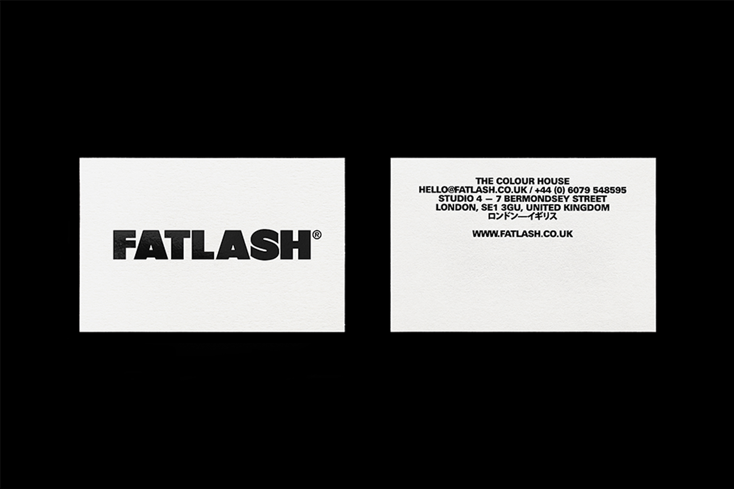 Two white business cards featuring bold black Fatlash logo typography and contact details against a solid black background.