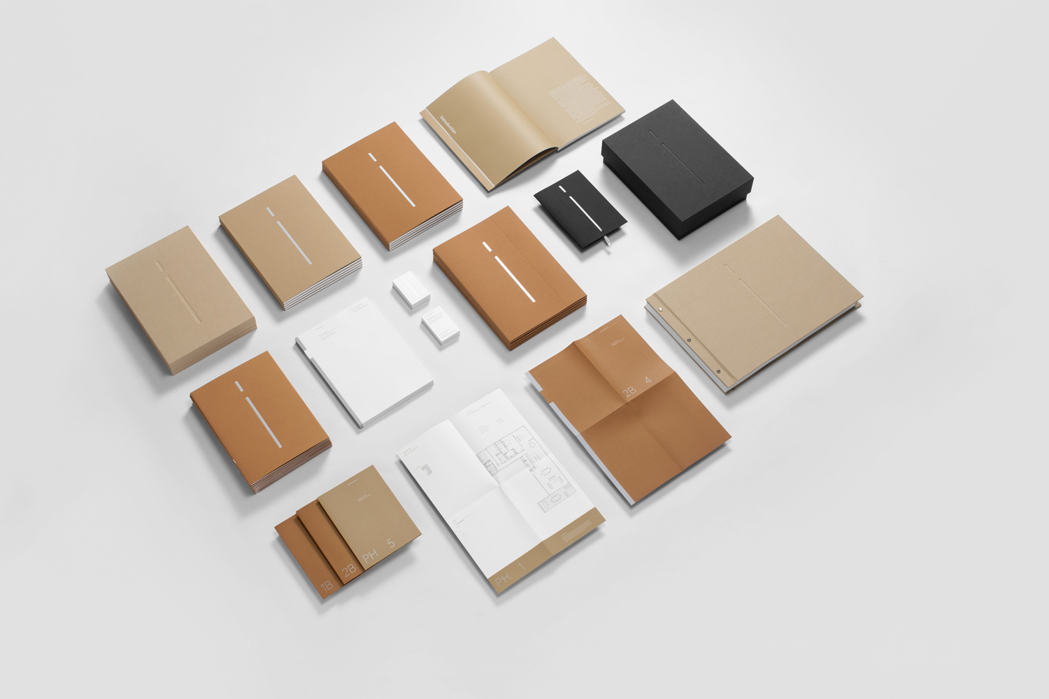 Flat lay of corporate stationery items including notebooks, folders, and cards in brown, tan, white, and black on a white background.