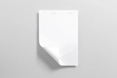 A blank white letterhead sheet with a curled bottom-left corner resting on a minimal light grey background.