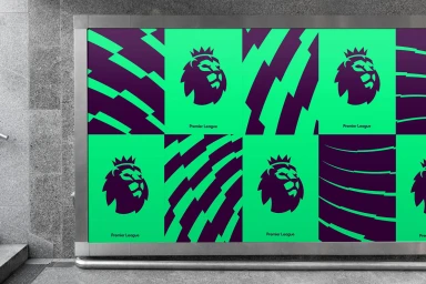 Outdoor billboard featuring vibrant green and purple Premier League brand identity graphics on a concrete wall.