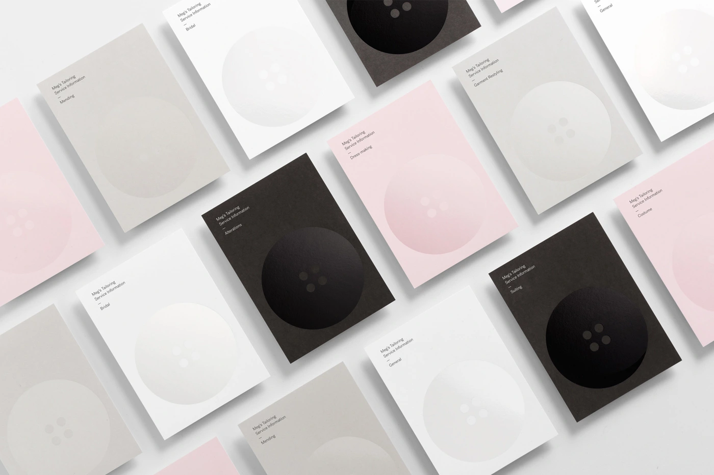 Grid of minimal stationery cards featuring large button graphics in pink white grey and black for Megs Tailoring