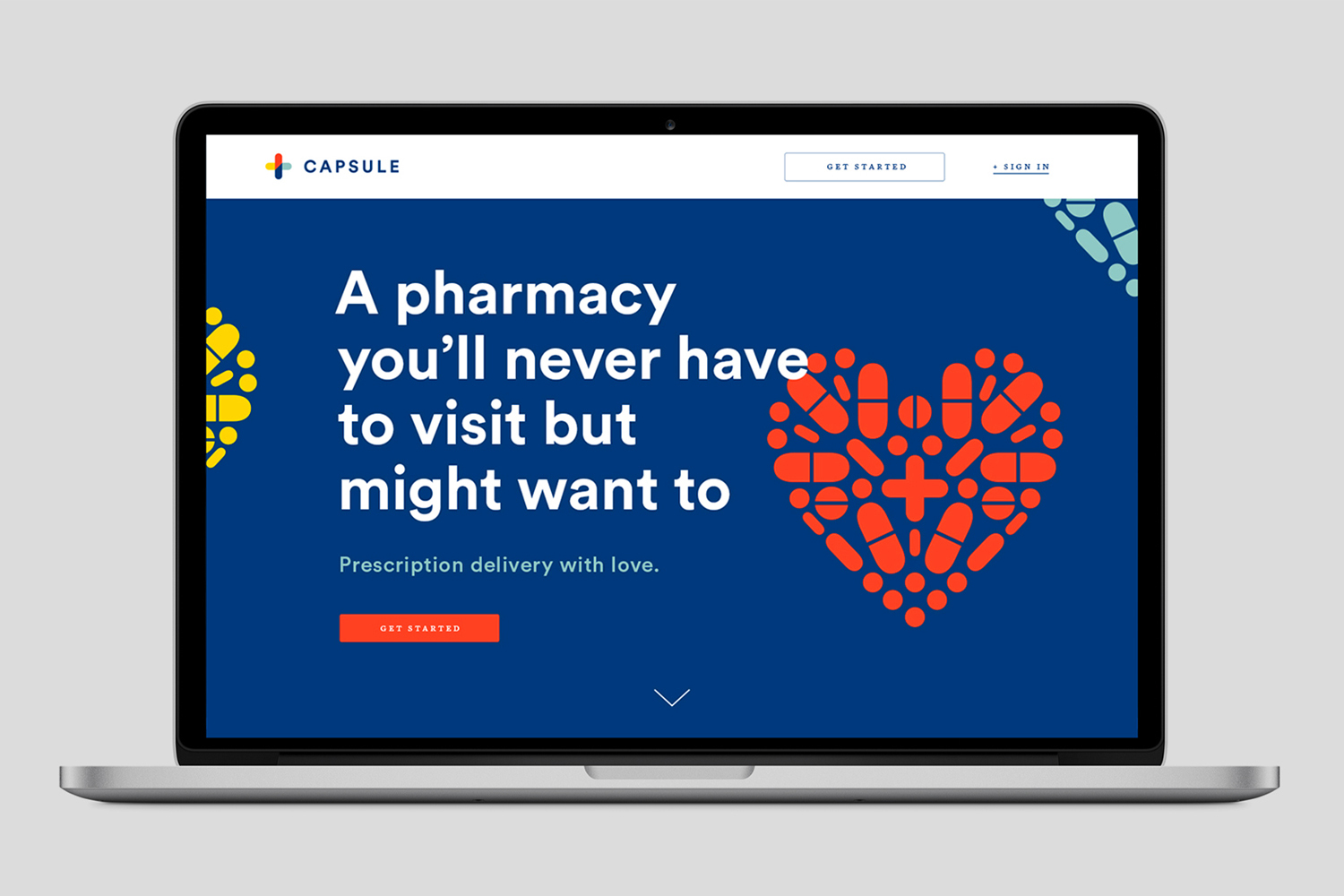 A laptop displaying the Capsule brand identity website on a white background with a large blue banner and red pill heart graphic