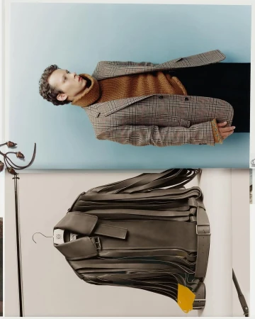 Portrait of a man wearing a plaid blazer and brown turtleneck sweater against a pale background, shot by Arnaud Lajeunie for Loewe Fall 2025.