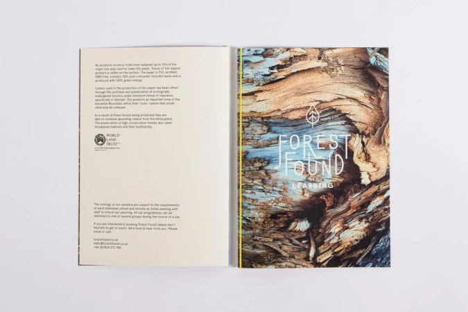 Open brochure for Forest Found with text page on left and detailed tree bark graphic on right against white background