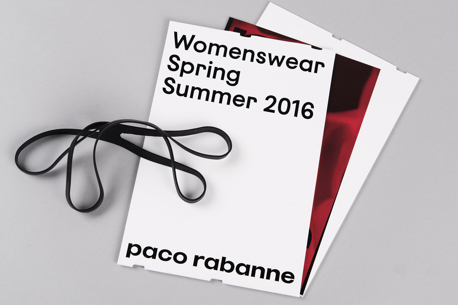 Printed document for Paco Rabanne womenswear spring summer 2016 brand identity featuring a black rubber band placed on top