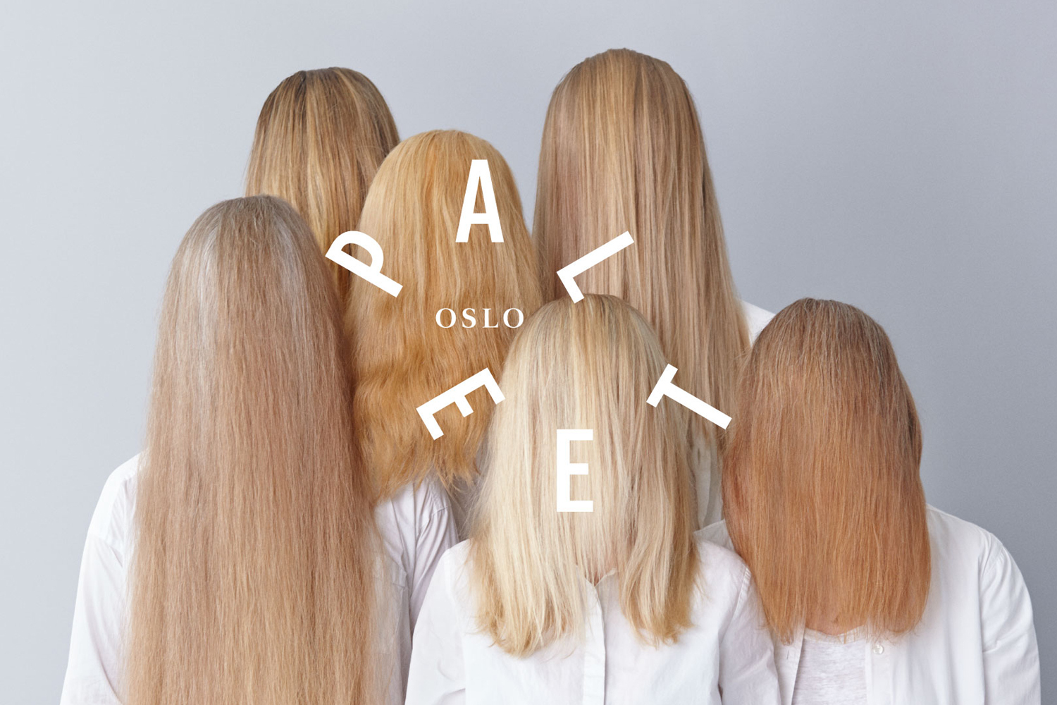 Group of six blonde people facing away from camera wearing white shirts against a grey background with white typography