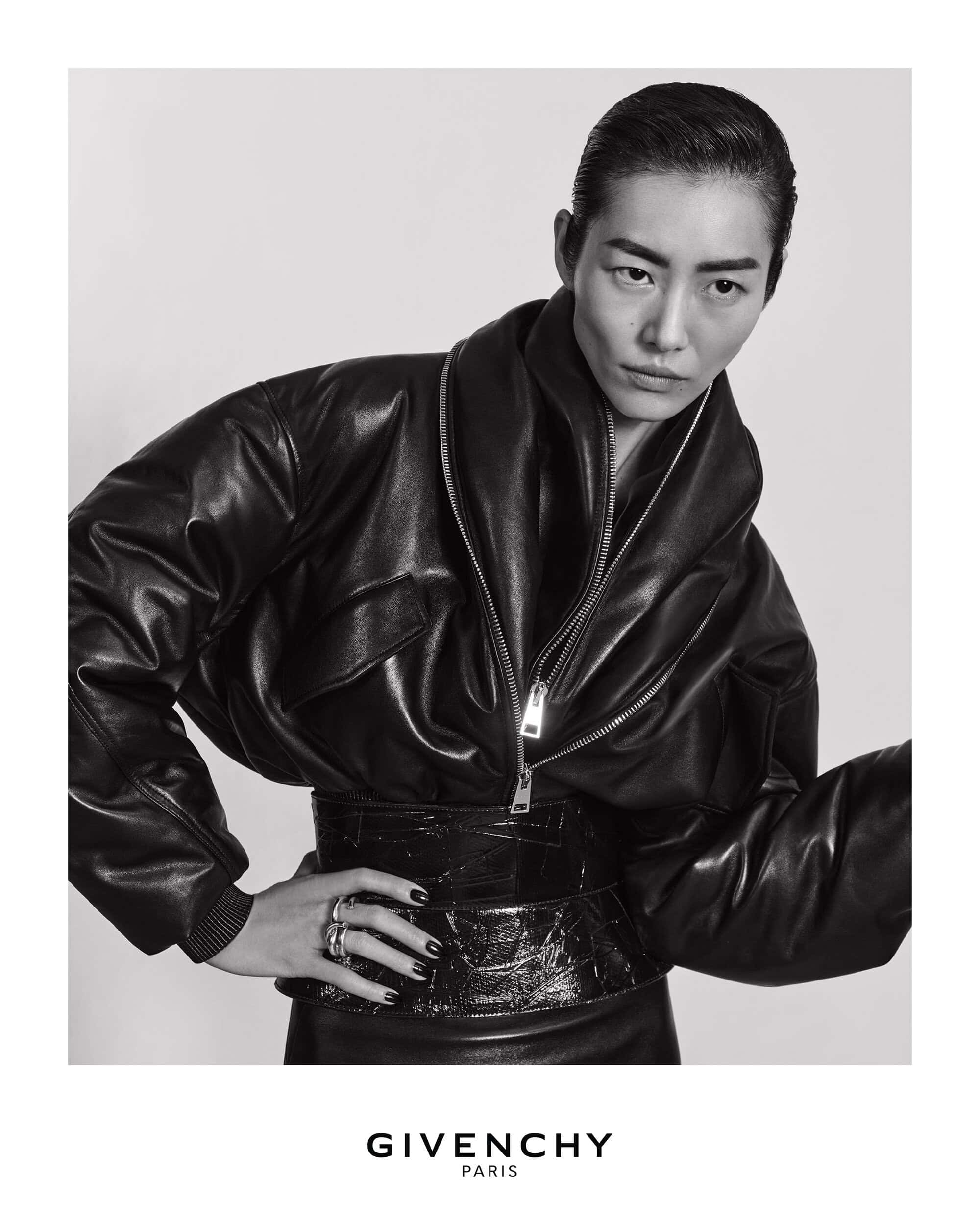 Liu Wen wearing a black leather jacket and wide belt in a black and white fashion portrait for Givenchy