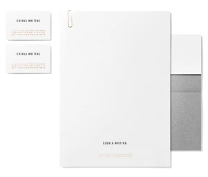 Branding materials for Cushla Whiting featuring business cards, letterhead with a paperclip, and an envelope on white