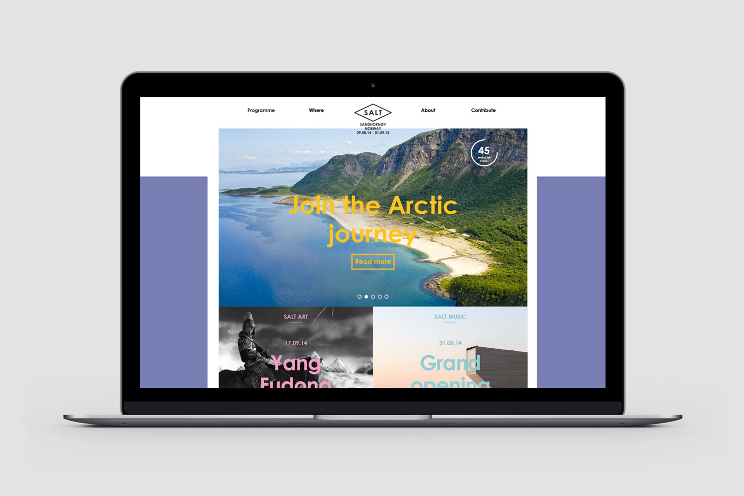 Mockup of a laptop displaying a website homepage featuring a coastal landscape header and two section panels below.