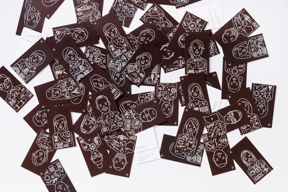 Scattered brown business cards featuring white line art portraits and illustrated icons against a white background