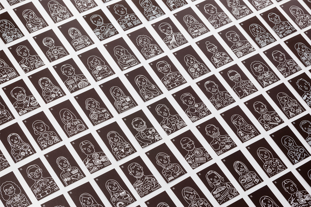 An array of dark rectangular cards featuring intricate white line art character illustrations laid out on a white surface.