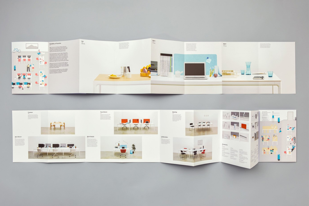 Two folded accordion brochures showing graphic design and workspace photography displayed on a plain grey background