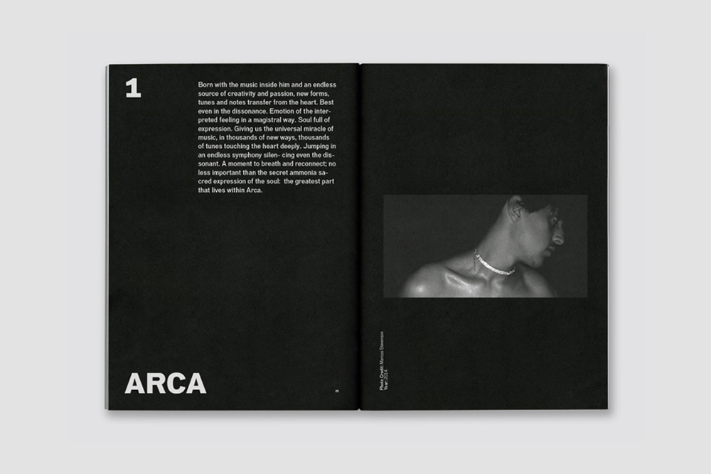 An open black book featuring white typography on the left page and a black and white photograph of a man's neck and shoulders on the right.