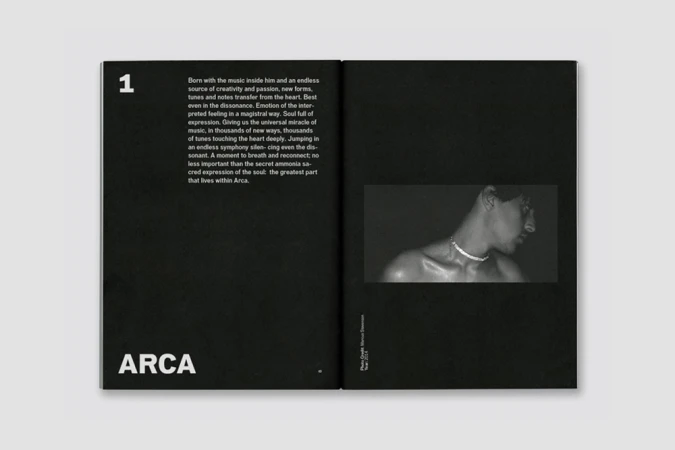 An open black book featuring white typography on the left page and a black and white photograph of a man's neck and shoulders on the right.