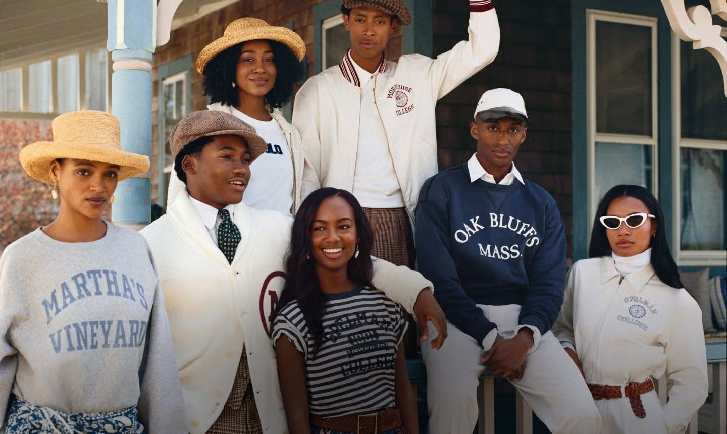 Group of seven models posing on a porch for Polo Ralph Lauren Oak Bluffs ad campaign shot by Nadine Ijewere.