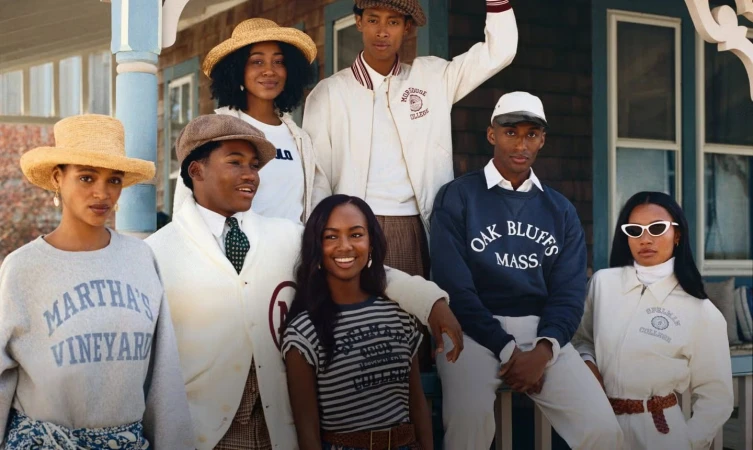 Group of seven models posing on a porch for Polo Ralph Lauren Oak Bluffs ad campaign shot by Nadine Ijewere.