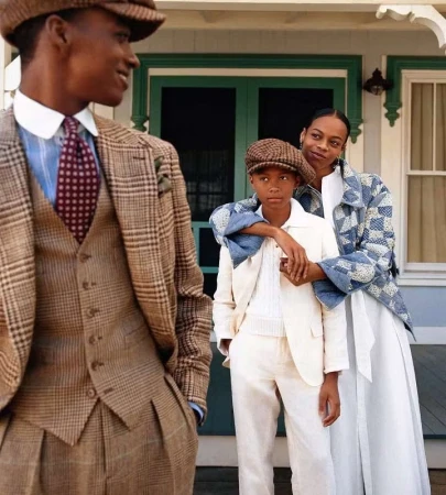 Group of models in patterned tweed suits and casual wear posing outdoors on a porch for Polo Ralph Lauren Oak Bluffs campaign.