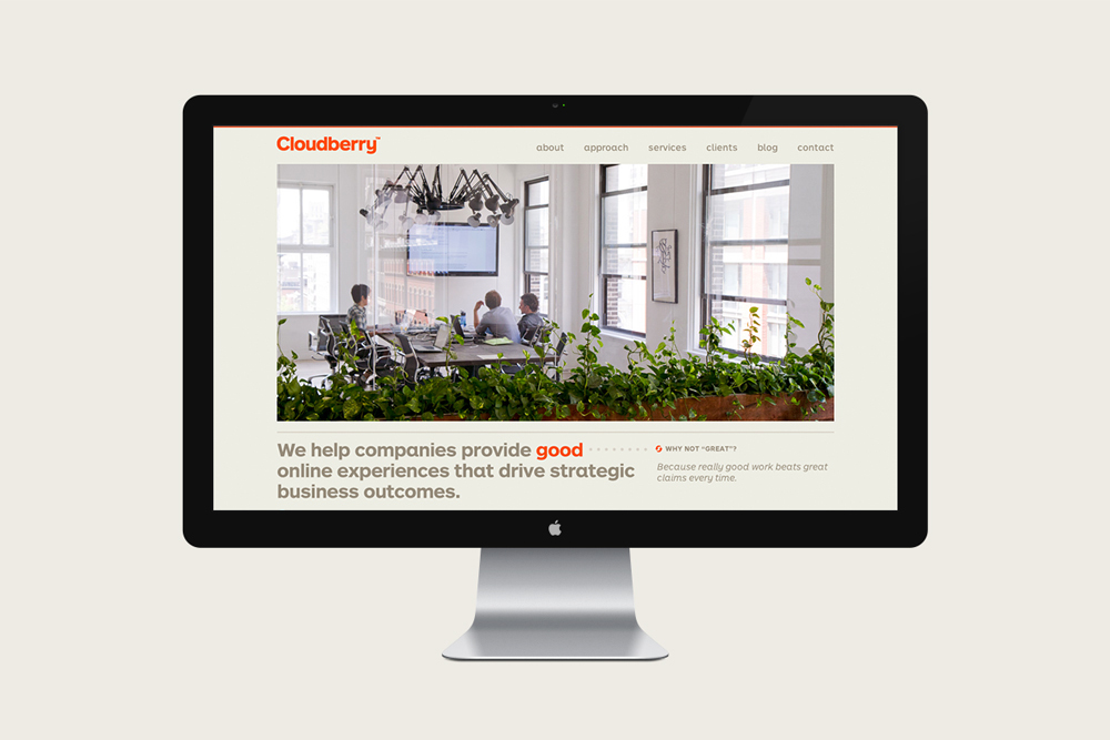 Desktop computer monitor displaying a website mockup for Cloudberry against a plain light background