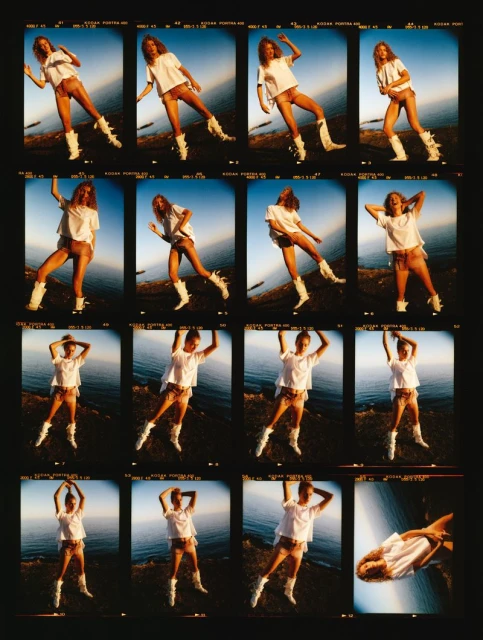 Sheet of Kodak film showcasing a fashion model wearing a white shirt, tan shorts, and white boots posing outdoors by the water.