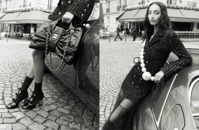Monochrome fashion campaign image featuring Mona Tougaard leaning against a car in Paris wearing Chanel tweed and pearls