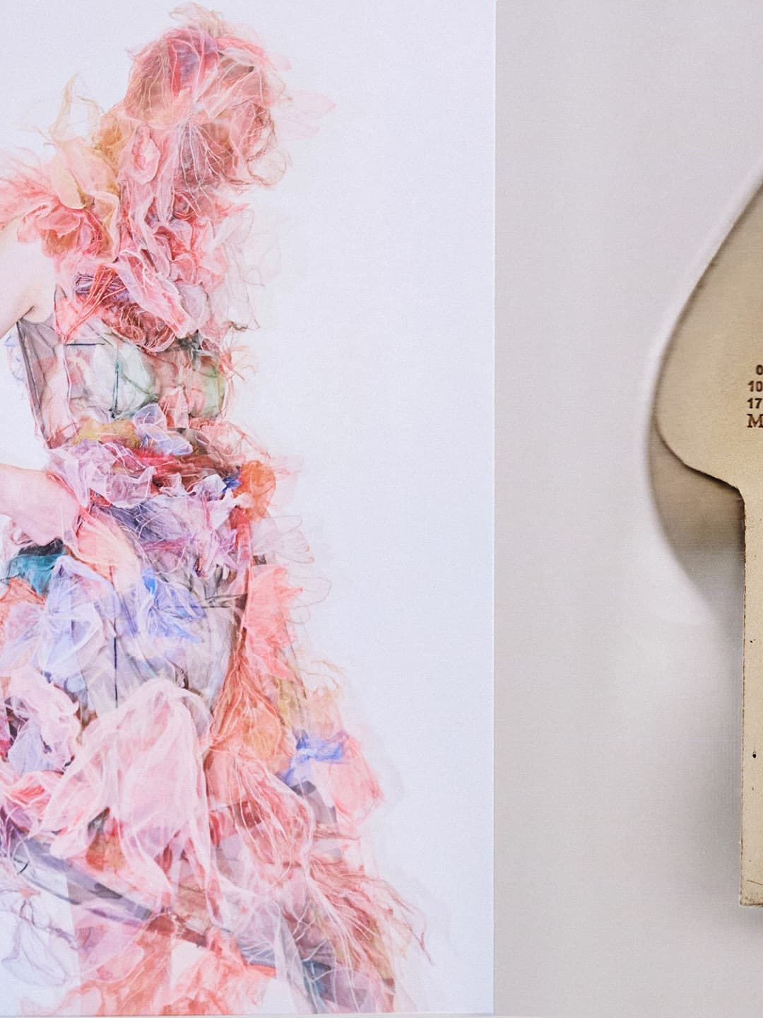 Model wearing a layered pink ruffled couture gown against a minimalist white background for Maison Margiela Artisanal Fall 2025 campaign.