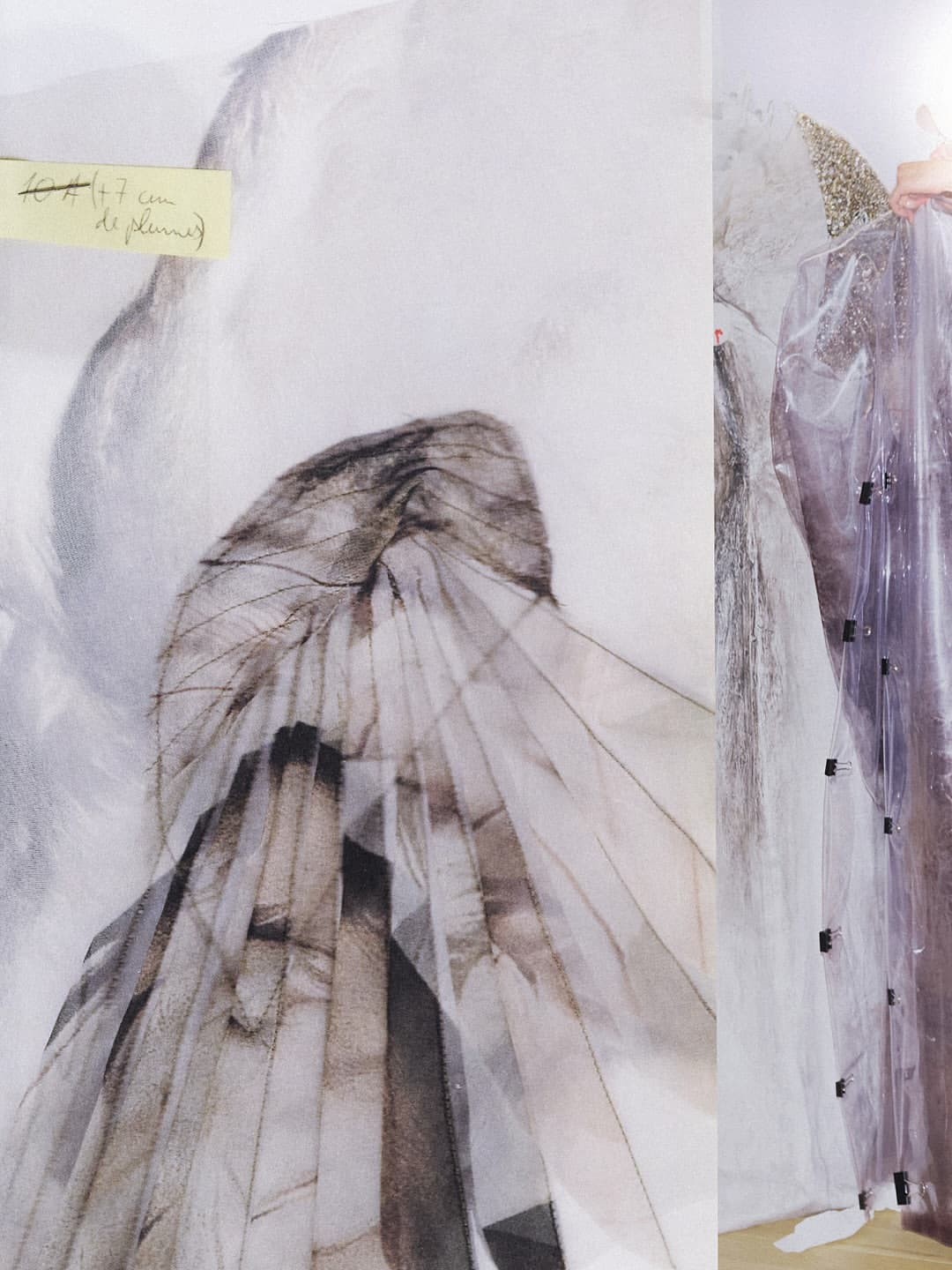 Layered translucent textile art piece with sketched figure details and a yellow sticky note