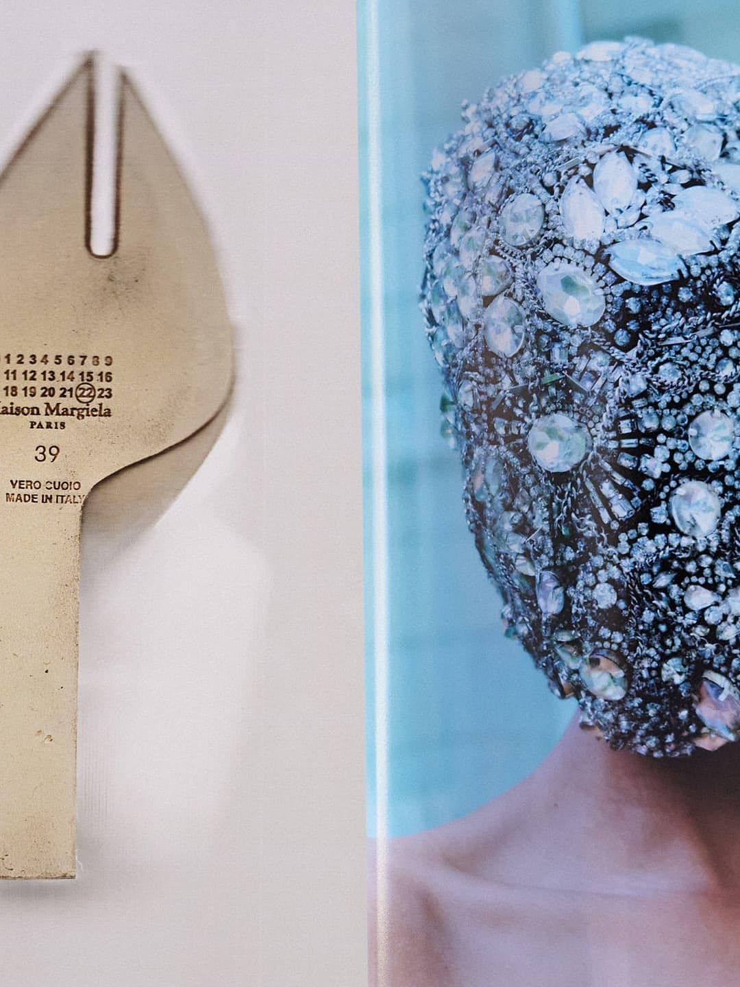 Close-up of a shoe sole bearing the Maison Margiela numeric logo beside a heavily embellished crystal headpiece