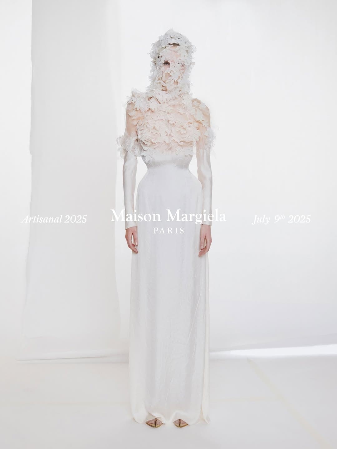 Model in a white gown and textured floral head covering against a neutral background for Maison Margiela Artisanal 2025.