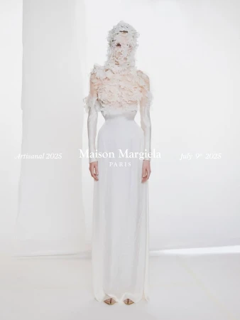 Model in a white gown and textured floral head covering against a neutral background for Maison Margiela Artisanal 2025.