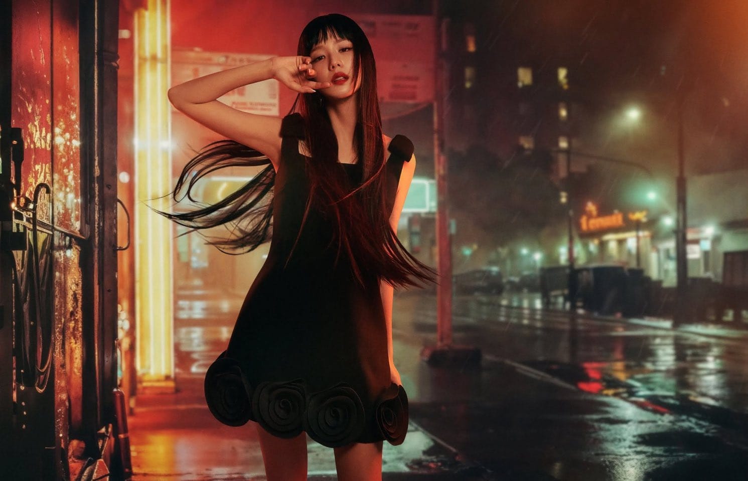 Jisoo in a black dress standing on a wet urban street at night for Self-Portrait Fall 2025 campaign