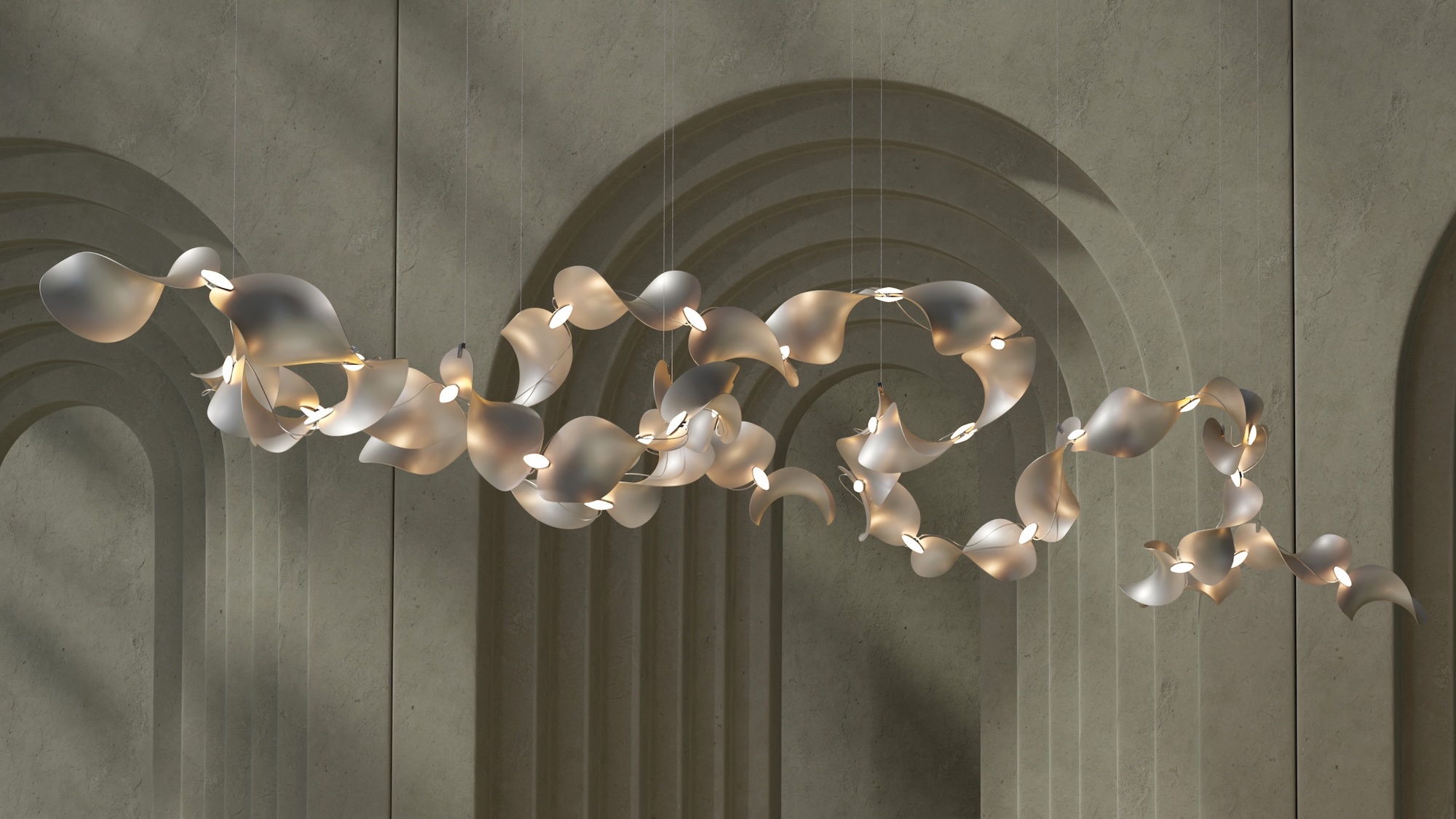 An organic sculptural pendant light installation suspended in front of an architectural wall with arched alcoves.