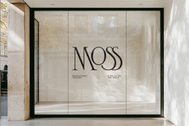 MOSS Objects store facade with large black typography and frosted glass window in a white stone building exterior.