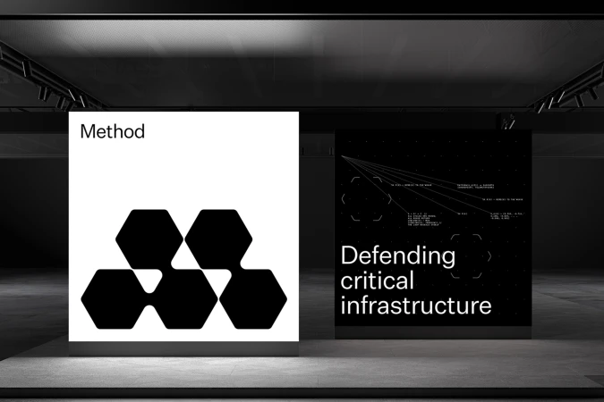 Digital brand identity display showing Method logo on a white panel next to a dark infrastructure interface panel in an exhibition space