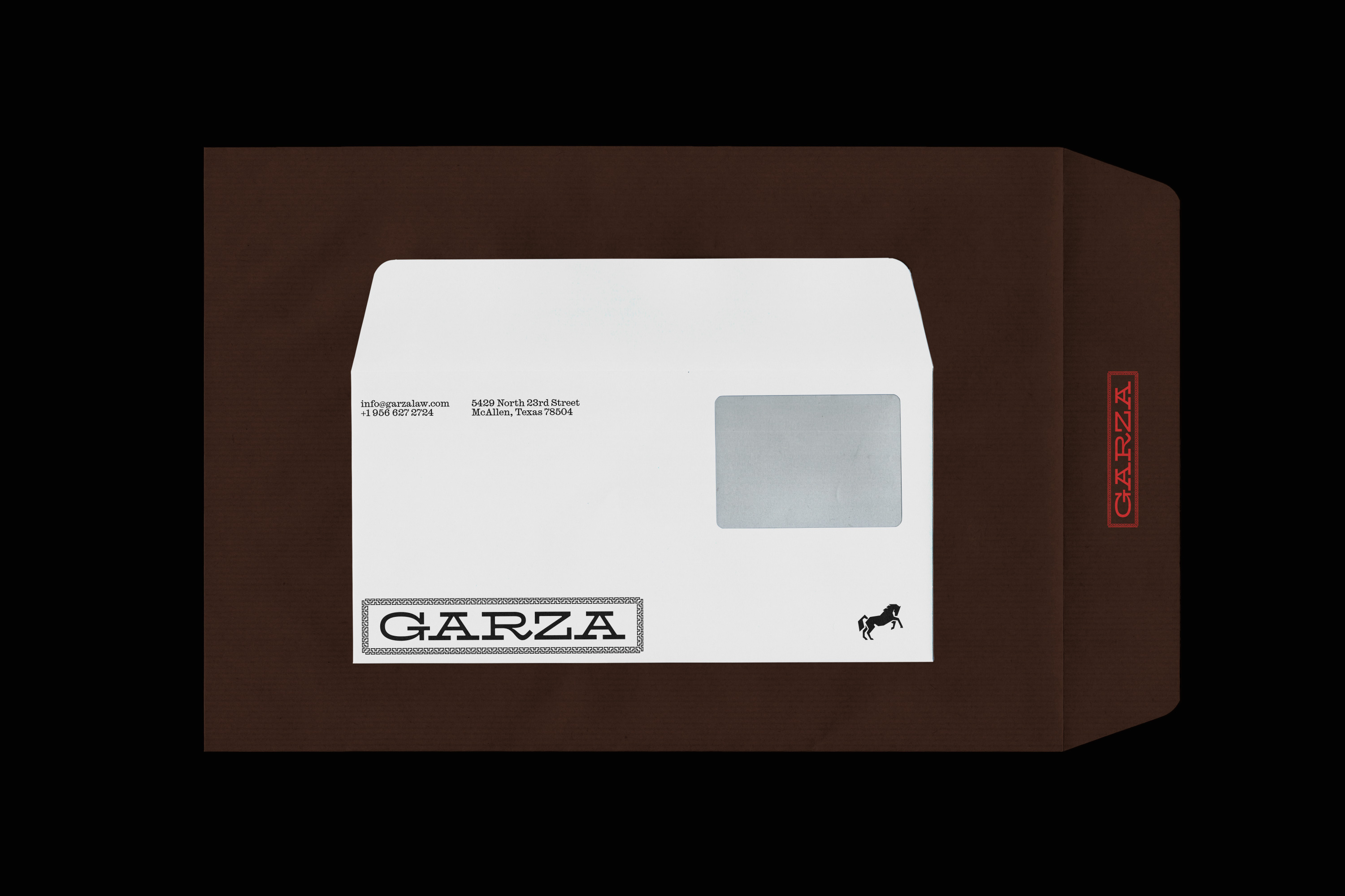 Brown envelope with window containing a white envelope featuring Garza Law branding, address, and horse icon.