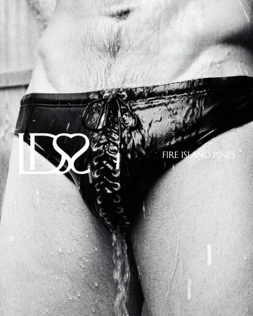 Close-up of a person wearing black lace-up swimwear with water droplets running down in a black and white campaign image.