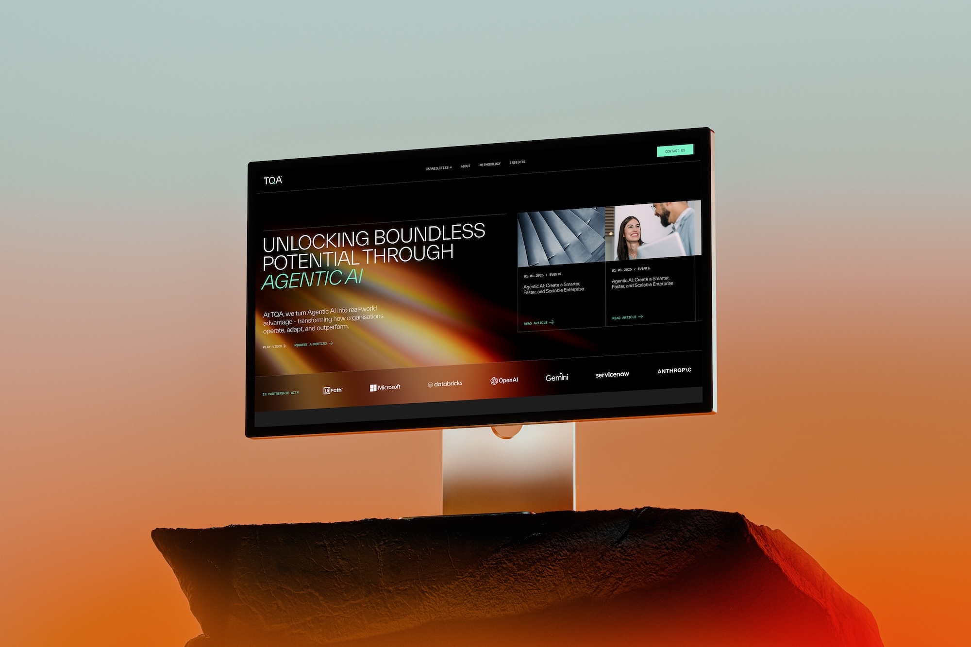 A modern computer monitor displaying a website interface against a gradient background in warm orange and teal tones.