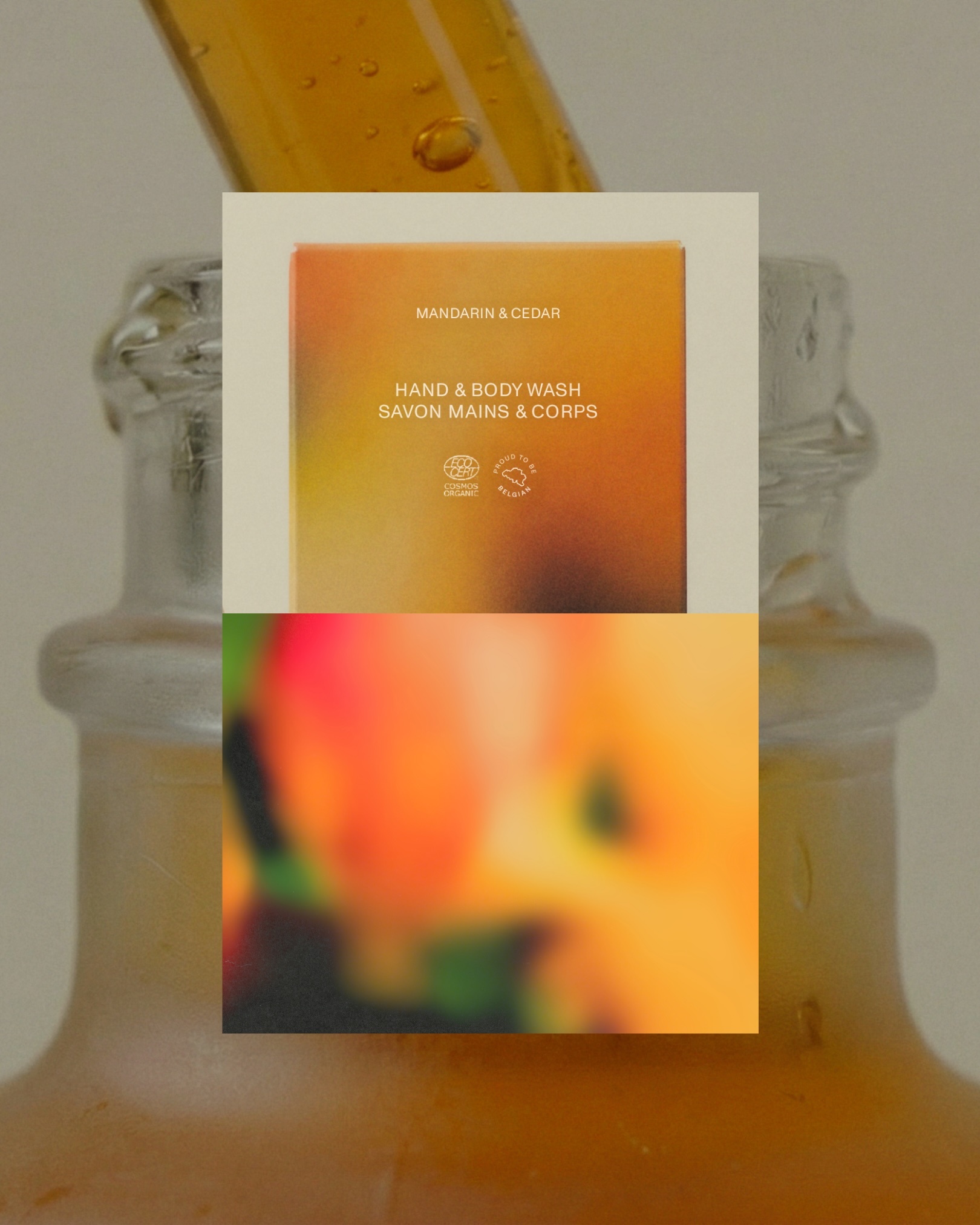 Close-up product shot of a skincare bottle with a dropper dispensing golden liquid, featuring a warm-toned label for CIME hand wash.