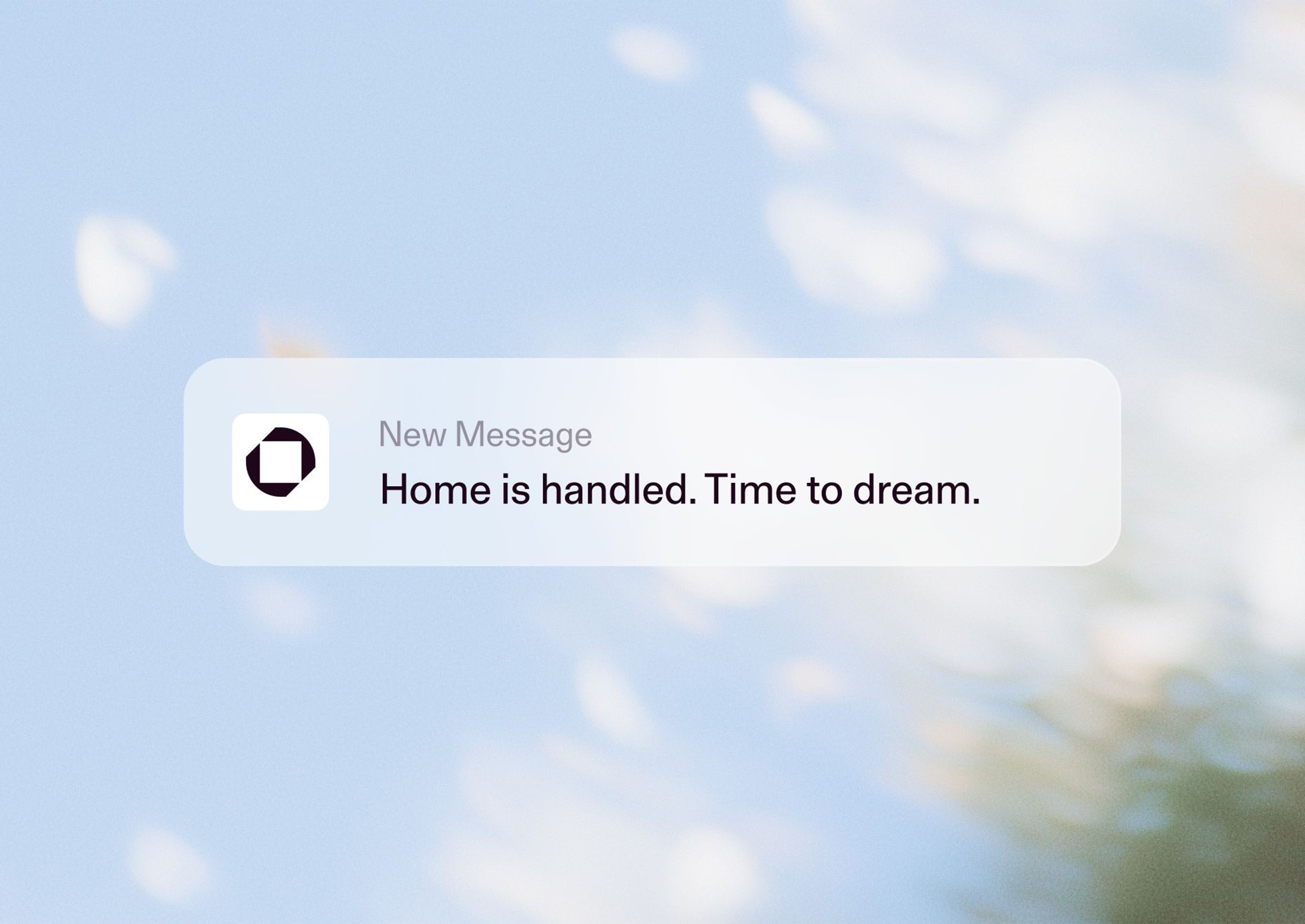 Notification banner with dark icon and text reading Home is handled over a soft blue sky background