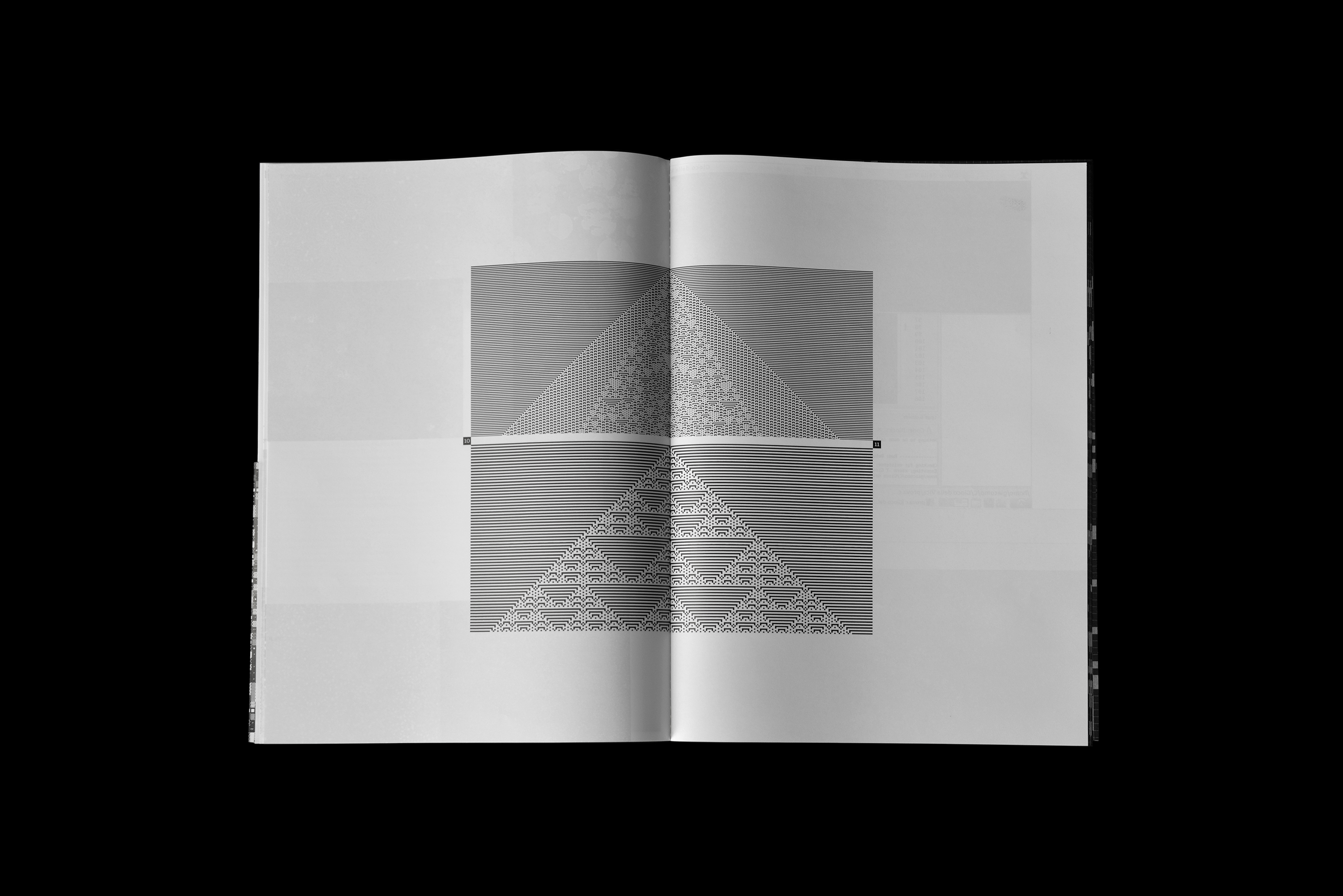 An open book displaying geometric black and white patterns and pyramid designs on its pages against a black background.