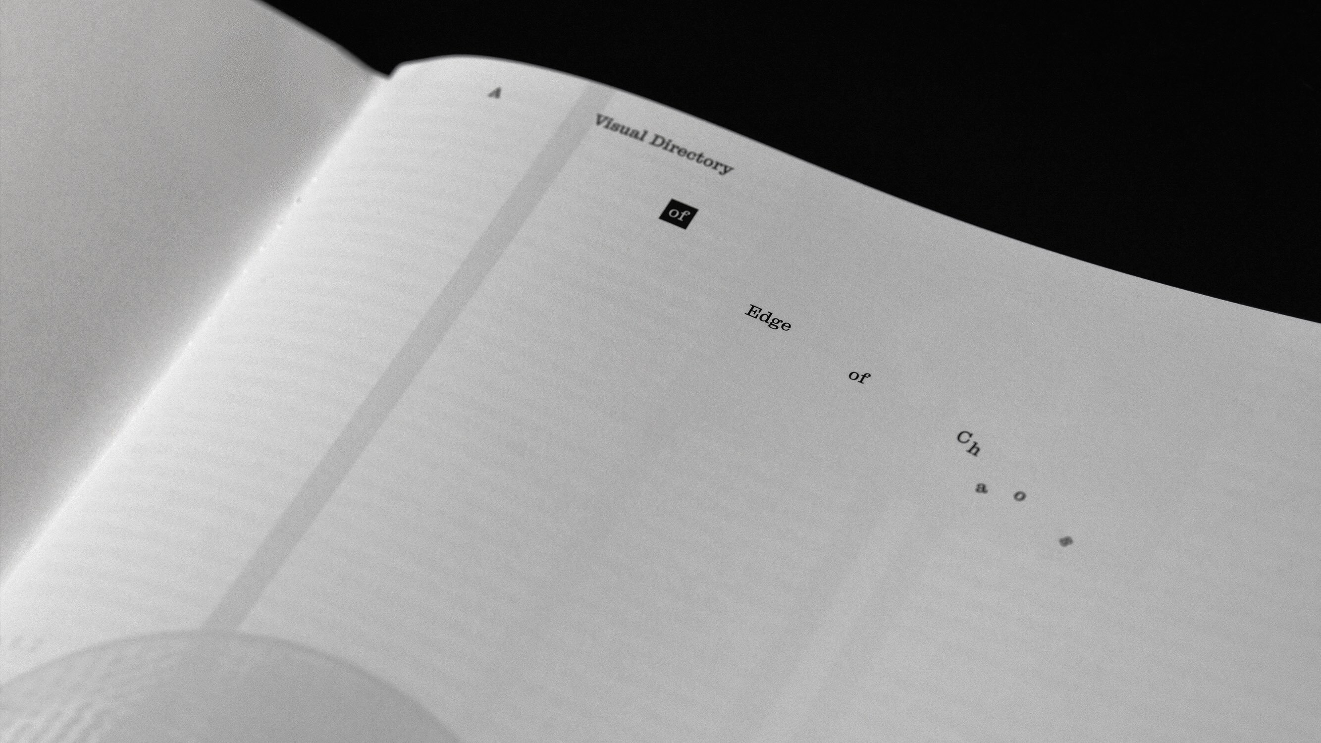 Monochrome close-up shot of an open book page titled Visual Directory of Edge of Chaos designed by Joyce Shi.