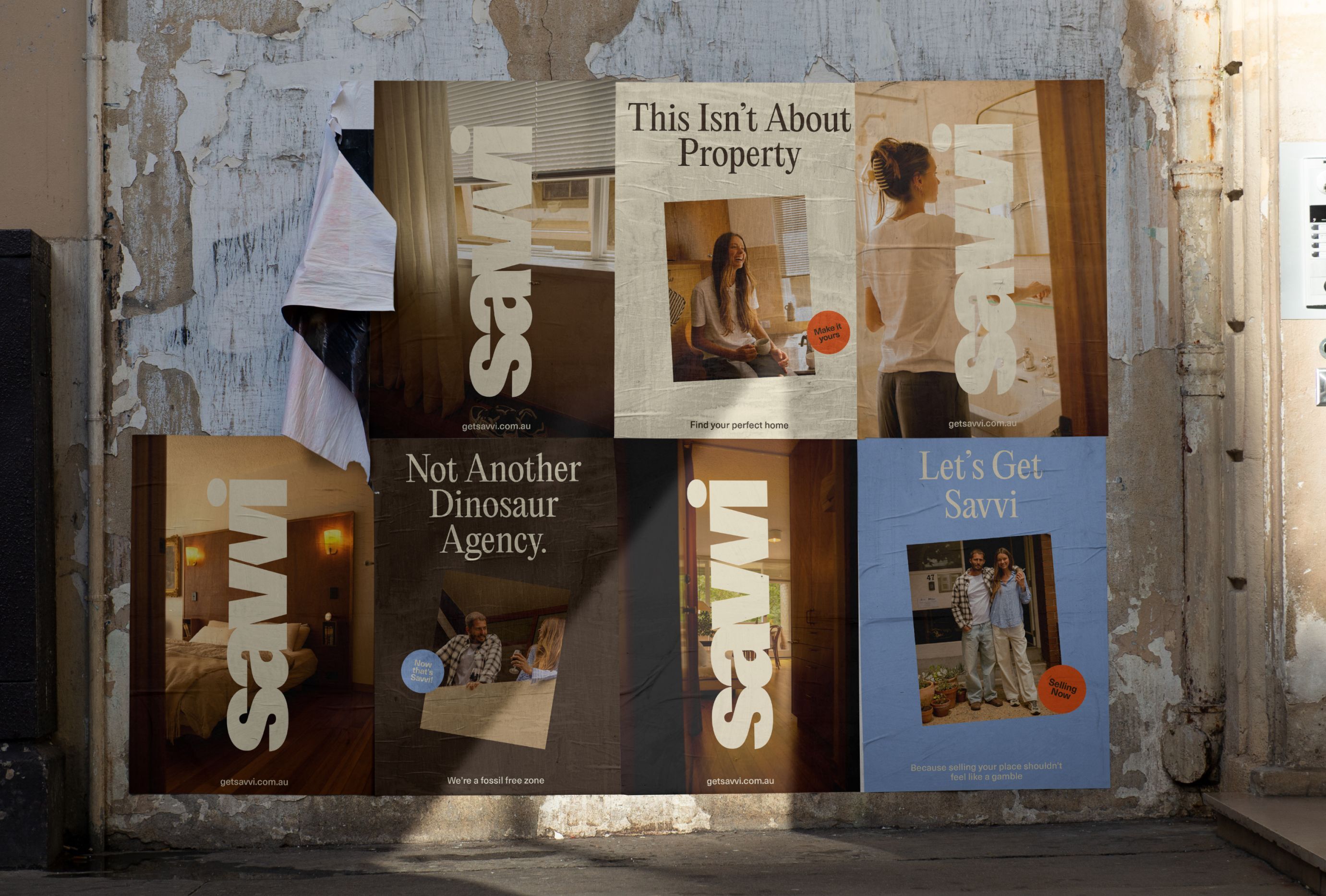 Posters pasted on a weathered stone wall displaying the Savvi Real Estate brand identity with photography and typography