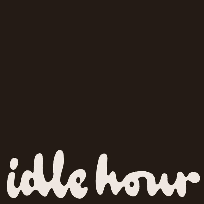 Idle Hour brand identity featuring custom cream lettering on a solid dark brown background.