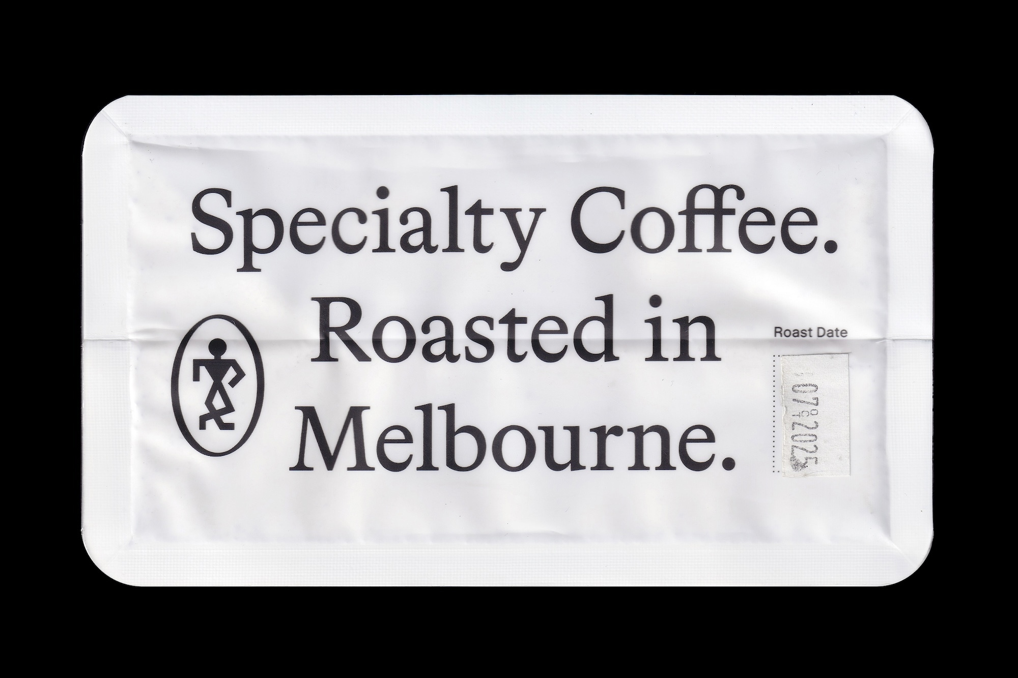 White specialty coffee packaging pouch with bold black typography reading Specialty Coffee Roasted in Melbourne against a black background
