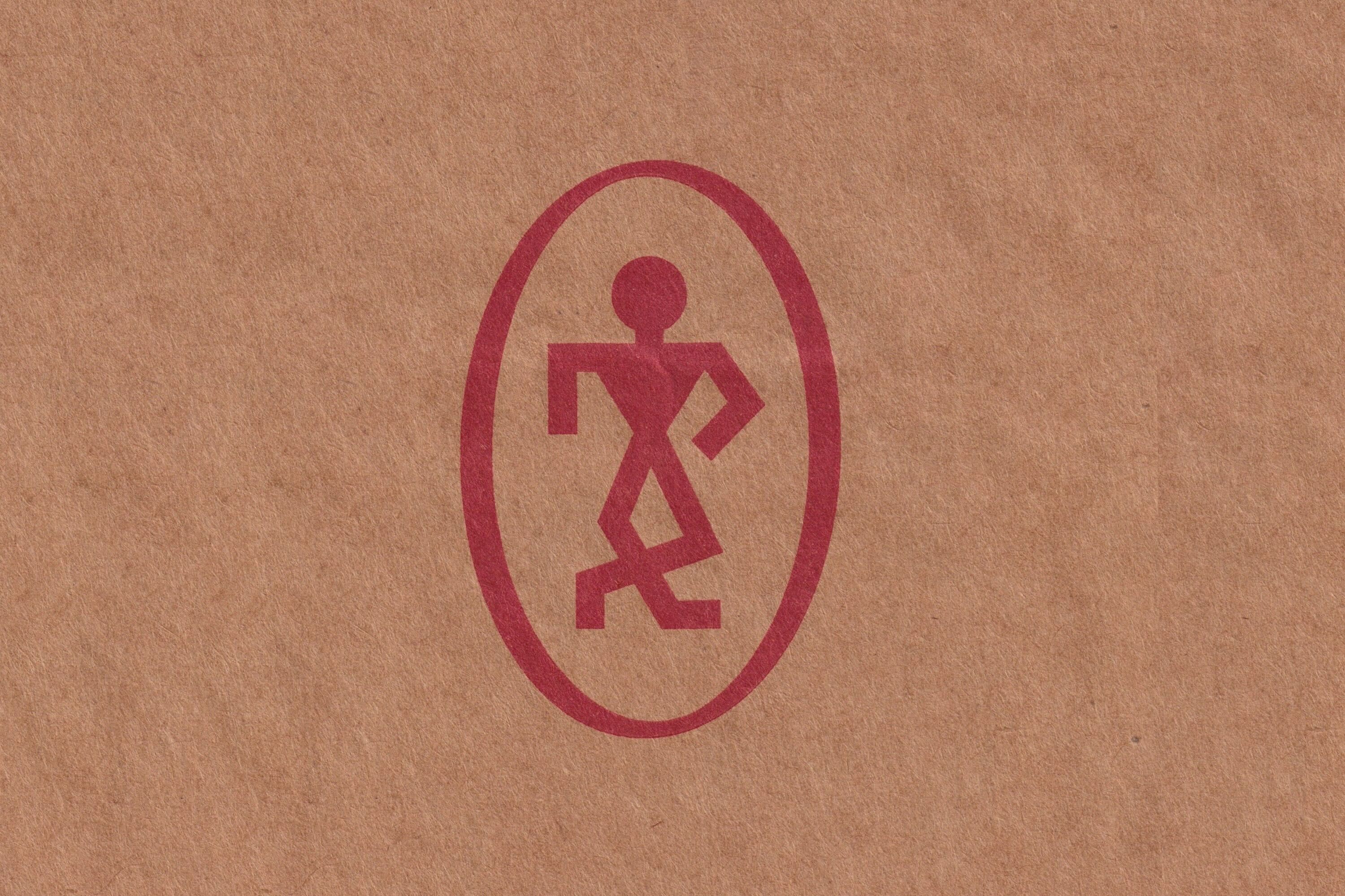 Red abstract human figure logo printed on a textured brown paper surface