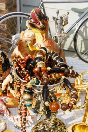 Beaded necklaces and vintage toys on display for Saint Laurent An Ordinary Day ad campaign