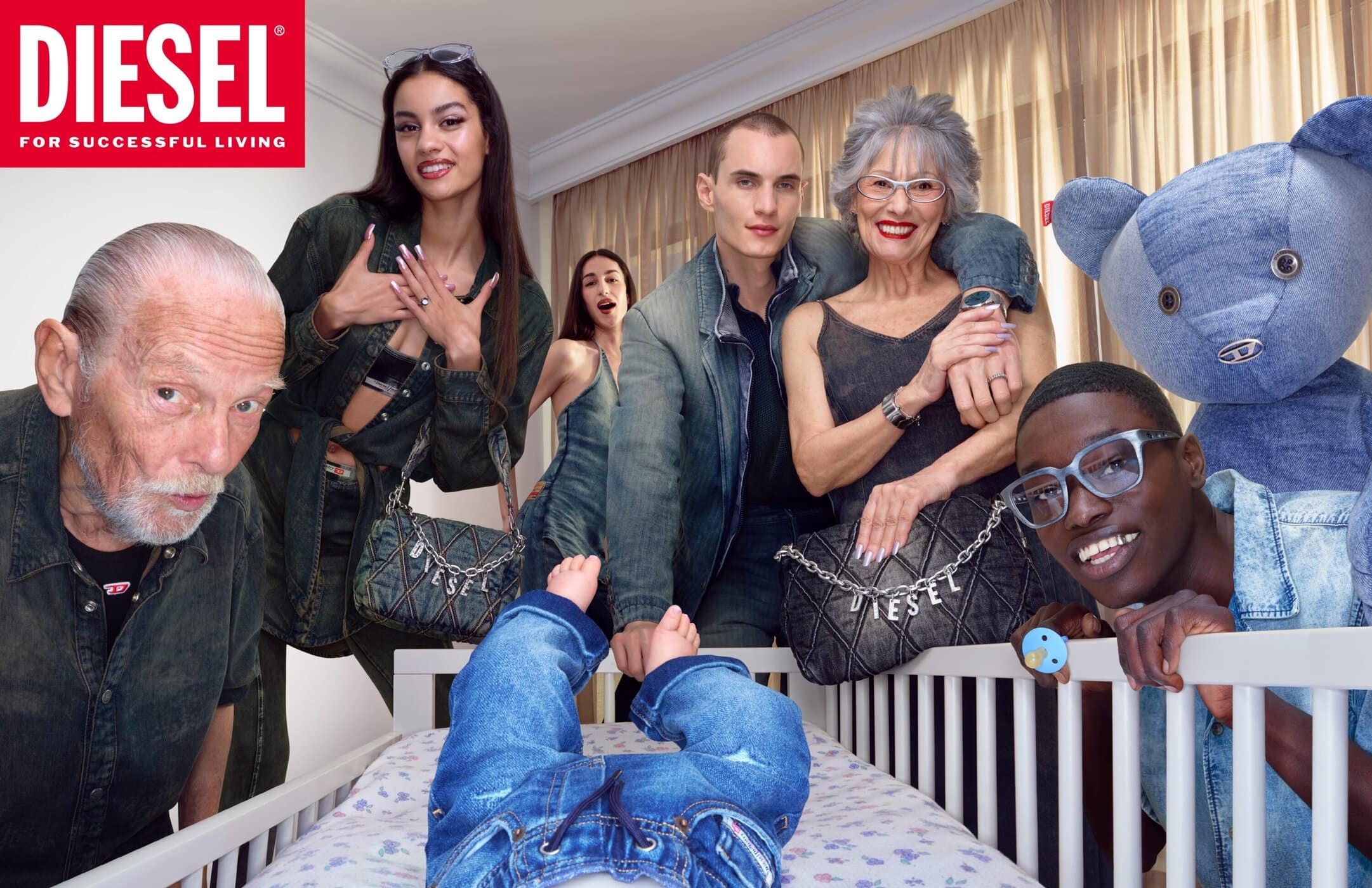 Group portrait of diverse models and people surrounding a baby crib with a giant denim teddy bear for Diesel.