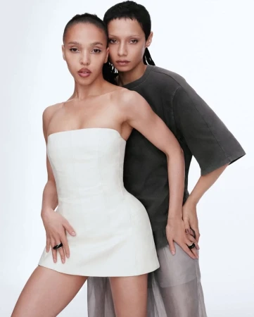 Two women posing together against a plain white background for the H&M Notes on Being spring 2025 campaign.