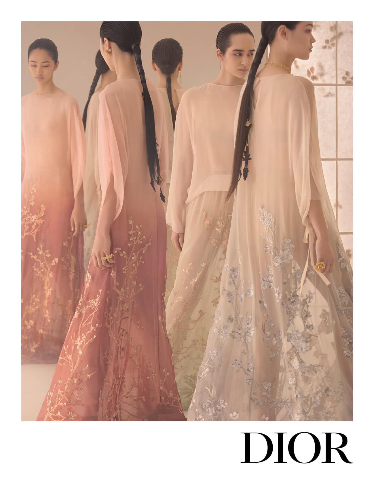 Models in flowing embroidered pastel dresses posing against a neutral interior background for Dior Fall 2025 campaign.